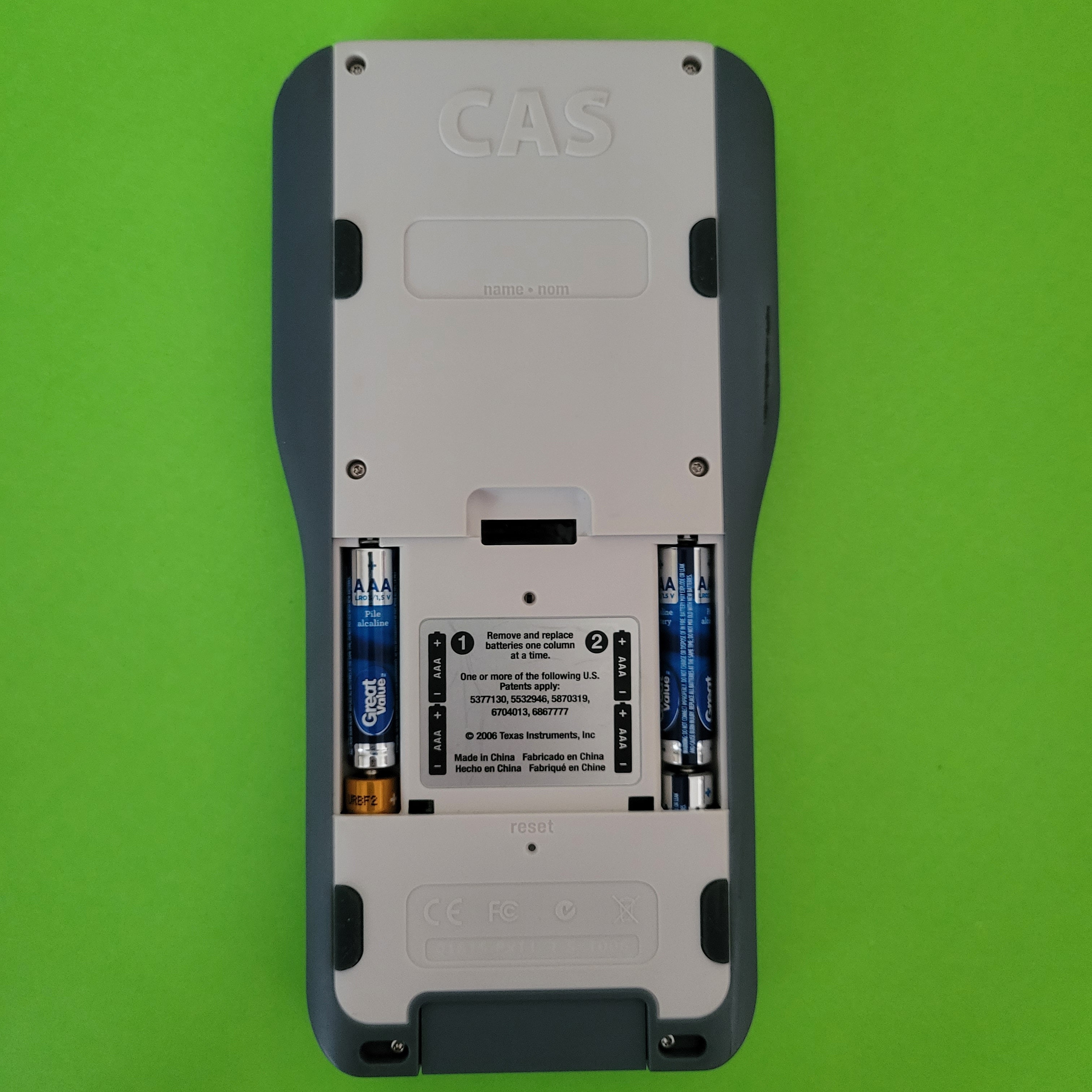 An image of the back of a texas instruments ti nspire cas plus symbolic calculator